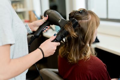 Professional hair stylist at work