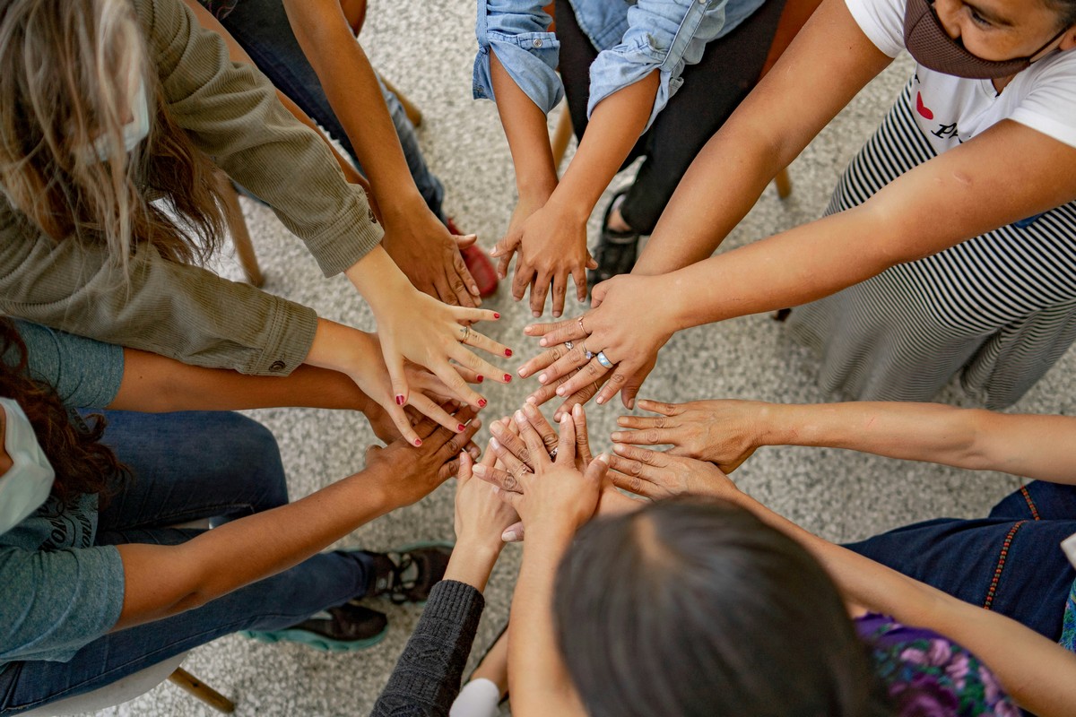 Community hands together in unity