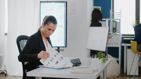 Reviewing website performance charts on a monitor