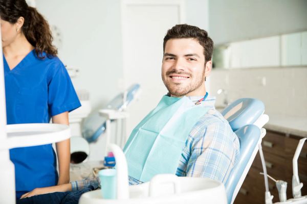 Dentist with a smiling patient in a dental clinic