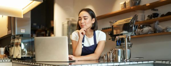 Shop owner checking her Google rankings at the counter