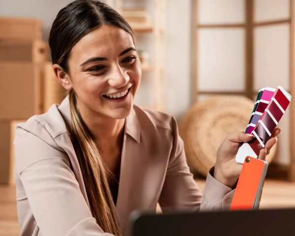 Smiling businesswoman holding a color palette