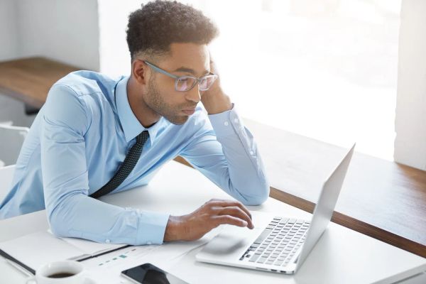 Business owner reviewing his landing page