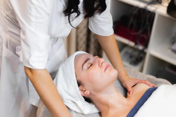 Esthetician treating a client at a med spa