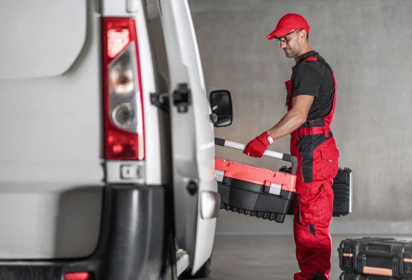 Contractor loading tools into his work van