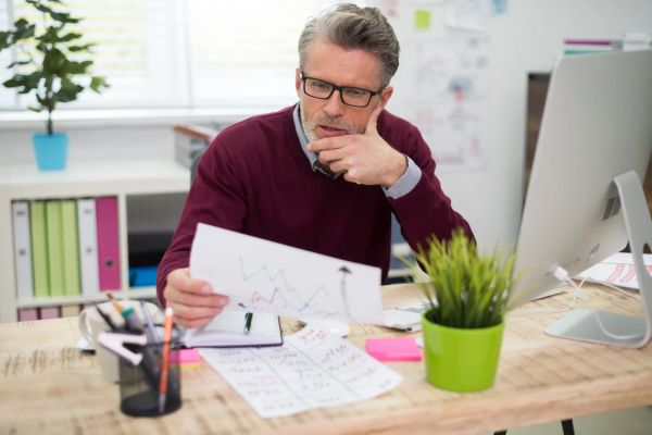 Reviewing website conversion data at a desk