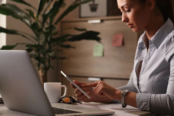Business owner browsing her website at her desk