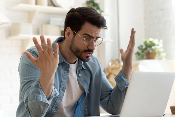 Frustrated business owner waiting on a slow website